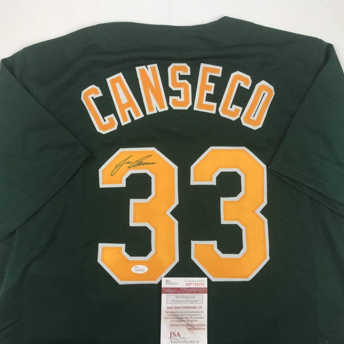 autographed-signed-jose-canseco-oakland-dark-green-baseball-jersey-jsa-coa