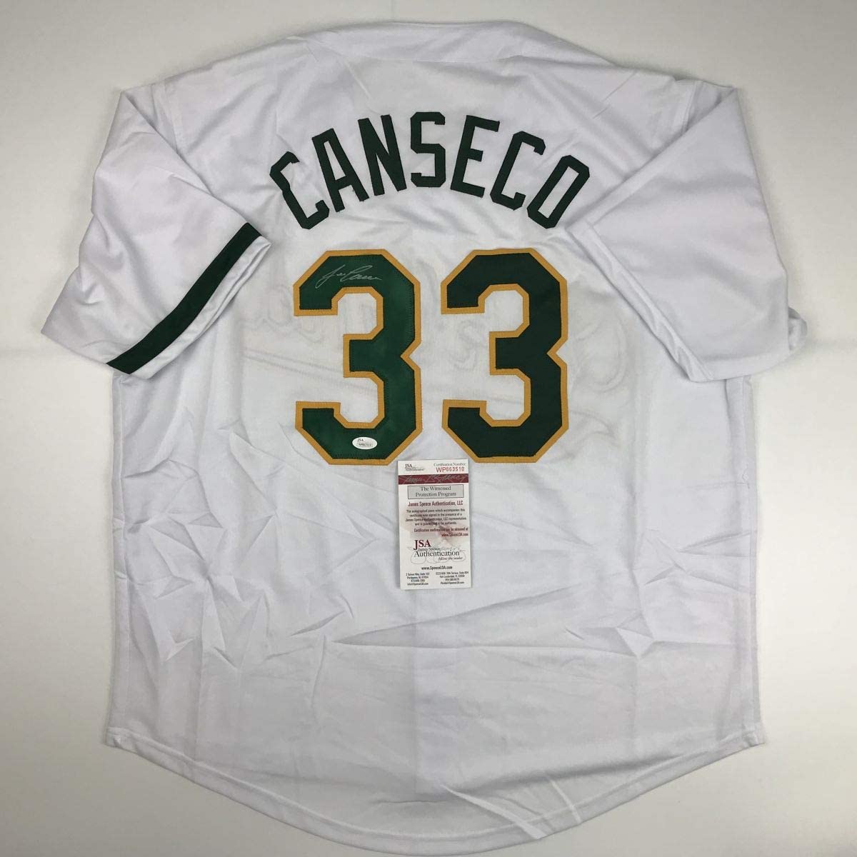 autographed-signed-jose-canseco-oakland-white-baseball-jersey-jsa-coa