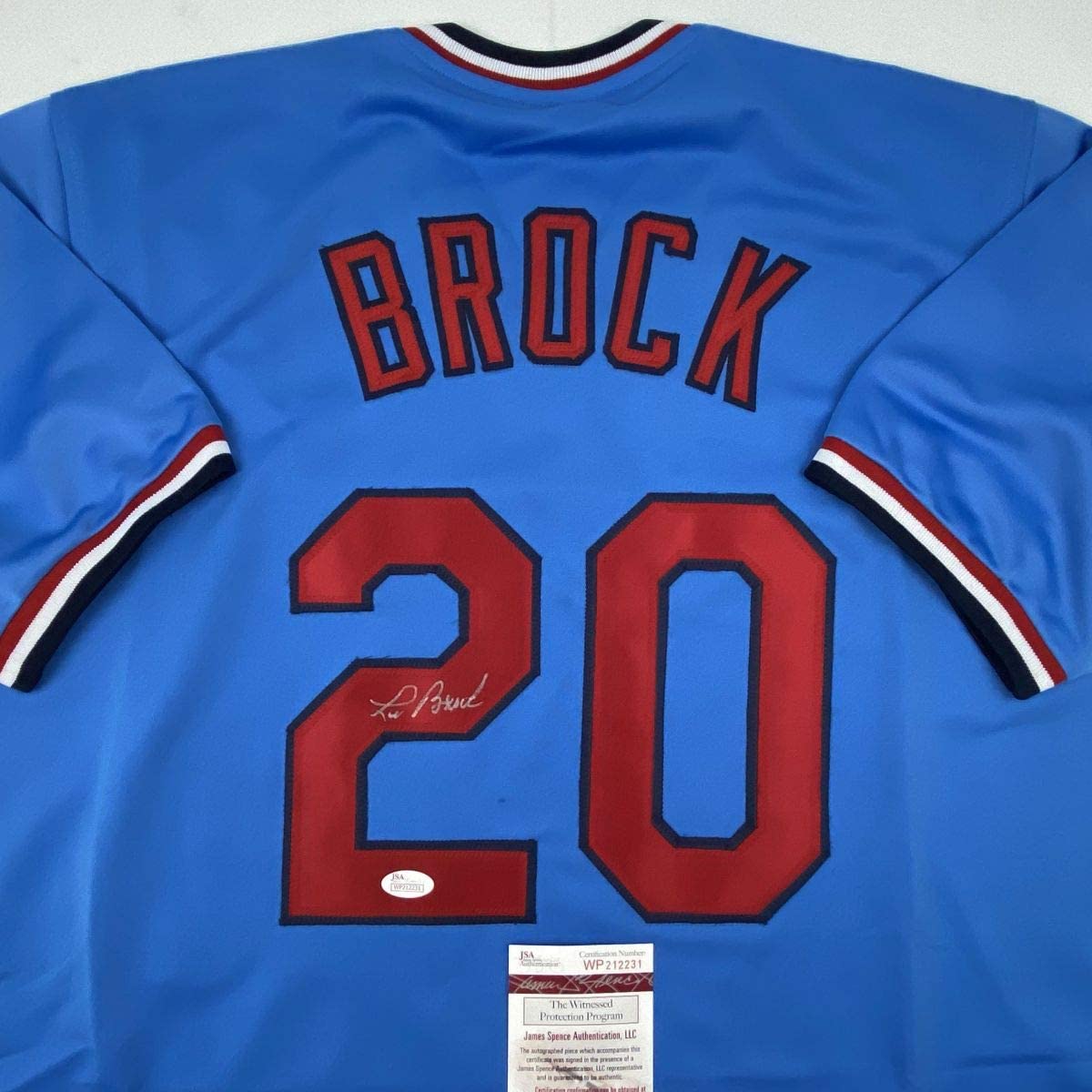 autographed-signed-lou-brock-st-louis-blue-baseball-jersey-jsa-coa
