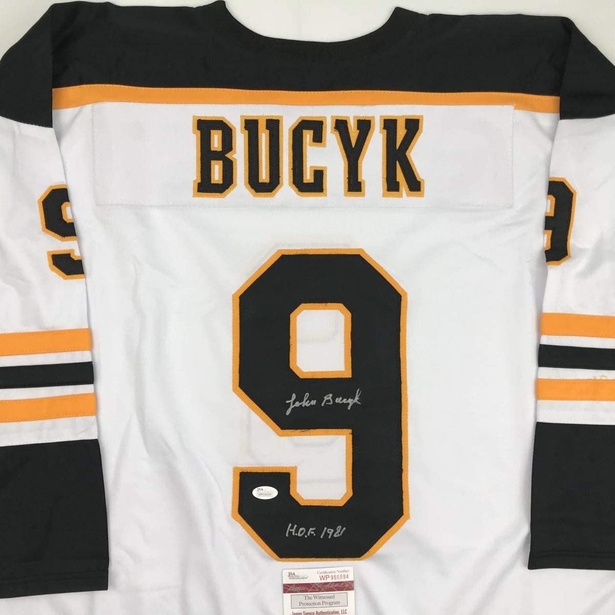 autographed-signed-johnny-john-bucyk-hof-1981-boston-white-hockey-jersey-jsa-coa