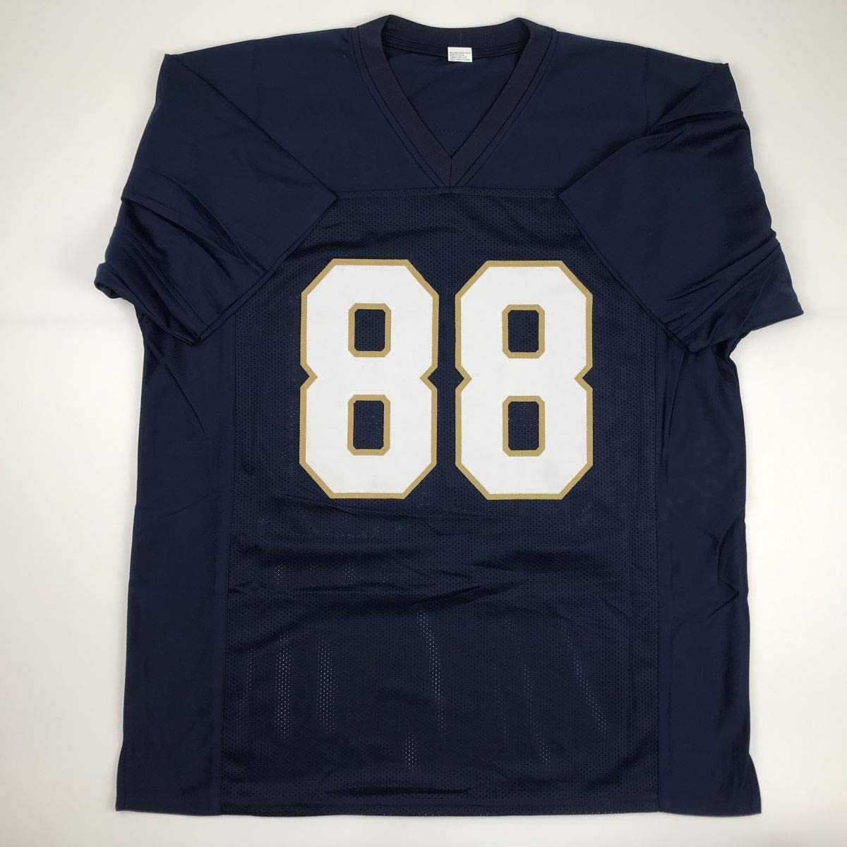 autographed-signed-lou-holtz-1988-national-champs-notre-dame-blue-college-football-jersey-jsa-coa