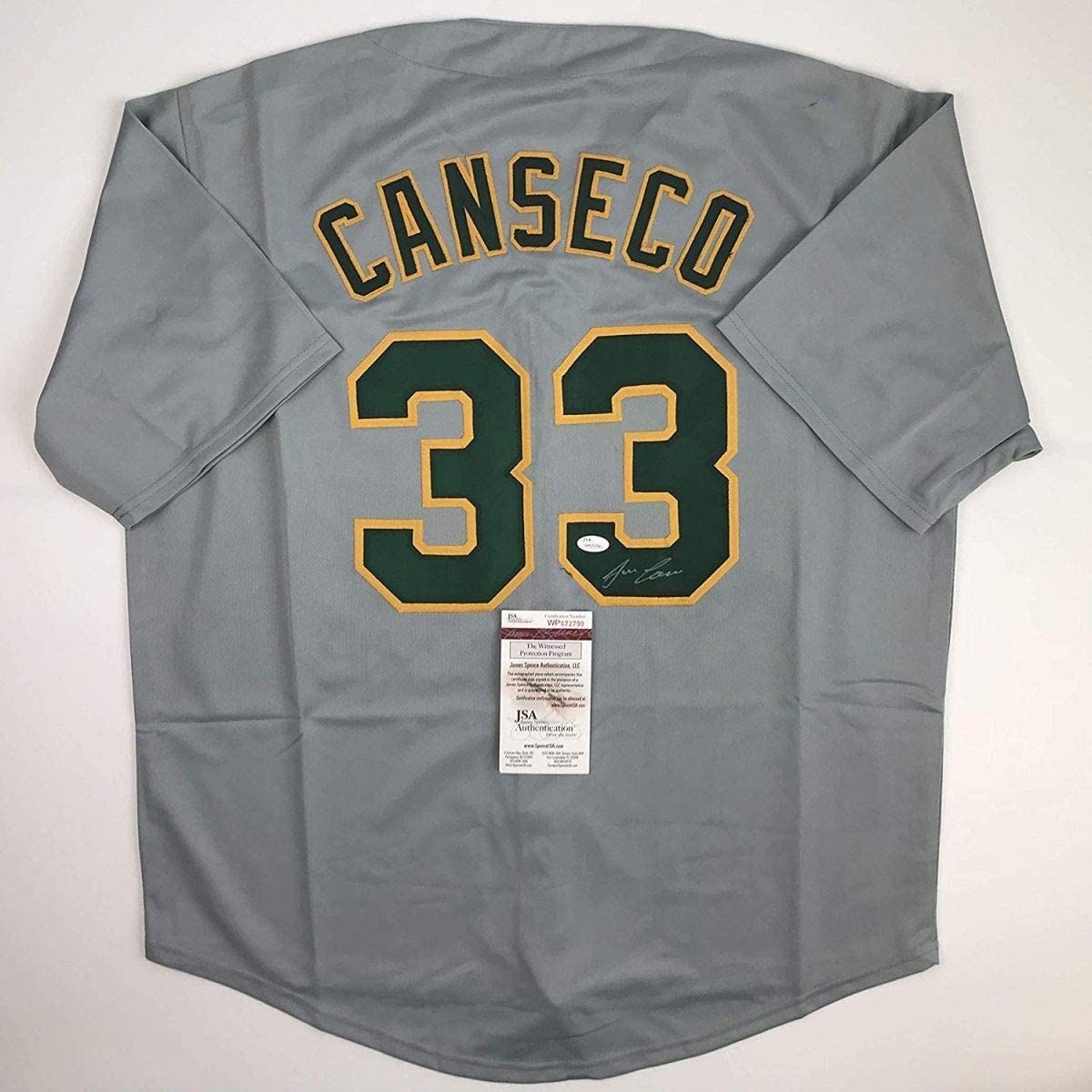 autographed-signed-jose-canseco-oakland-grey-baseball-jersey-jsa-coa