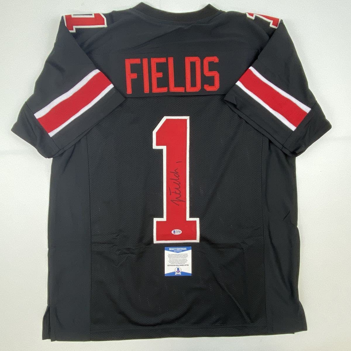 autographed-signed-justin-fields-ohio-state-black-college-football-jersey-beckett-bas-coa