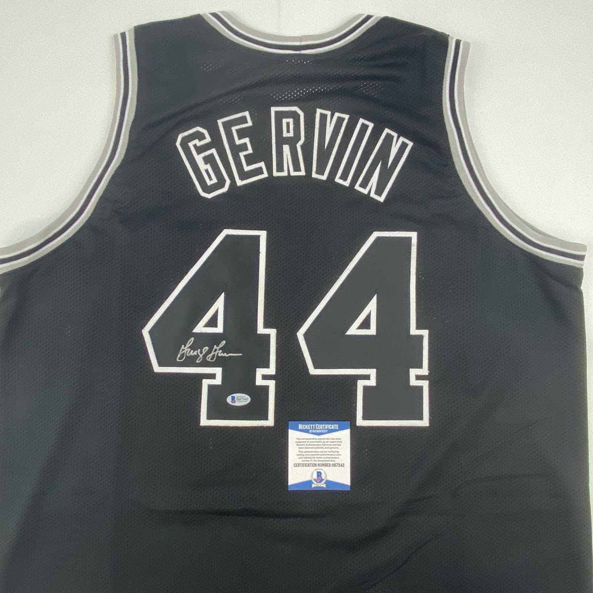 autographed-signed-george-gervin-san-antonio-black-basketball-jersey-beckett-bas-coa