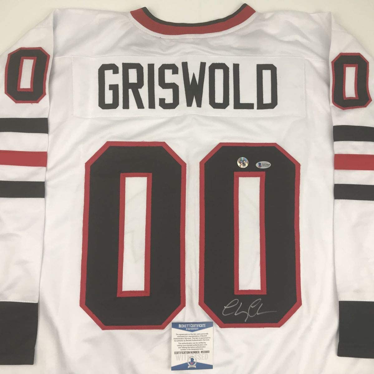 autographed-signed-chevy-chase-clark-griswold-christmas-vacation-movie-chicago-white-hockey-jersey-beckett-bas-coa