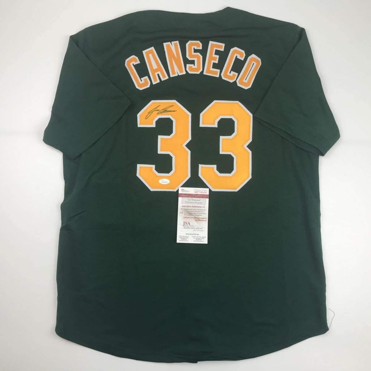 autographed-signed-jose-canseco-oakland-dark-green-baseball-jersey-jsa-coa