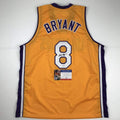 autographed-signed-kobe-bryant-8-los-angeles-yellow-basketball-jersey-psa-dna-coa