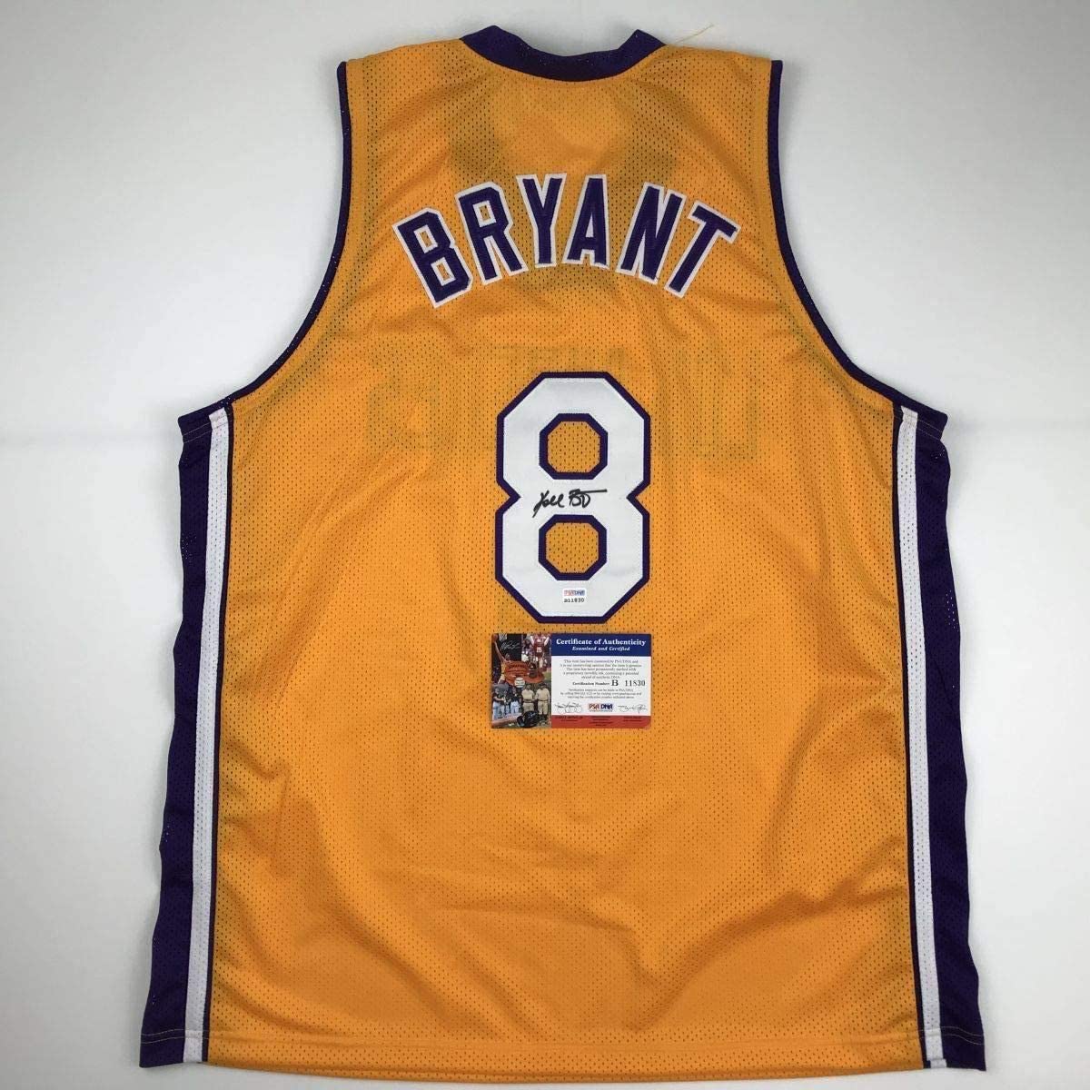 autographed-signed-kobe-bryant-8-los-angeles-yellow-basketball-jersey-psa-dna-coa