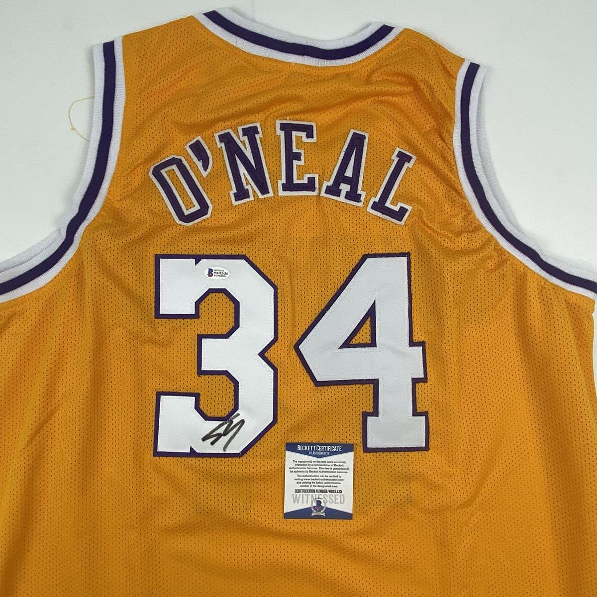 autographed-signed-shaquille-shaq-oneal-los-angeles-la-yellow-basketball-jersey-beckett-bas-coa