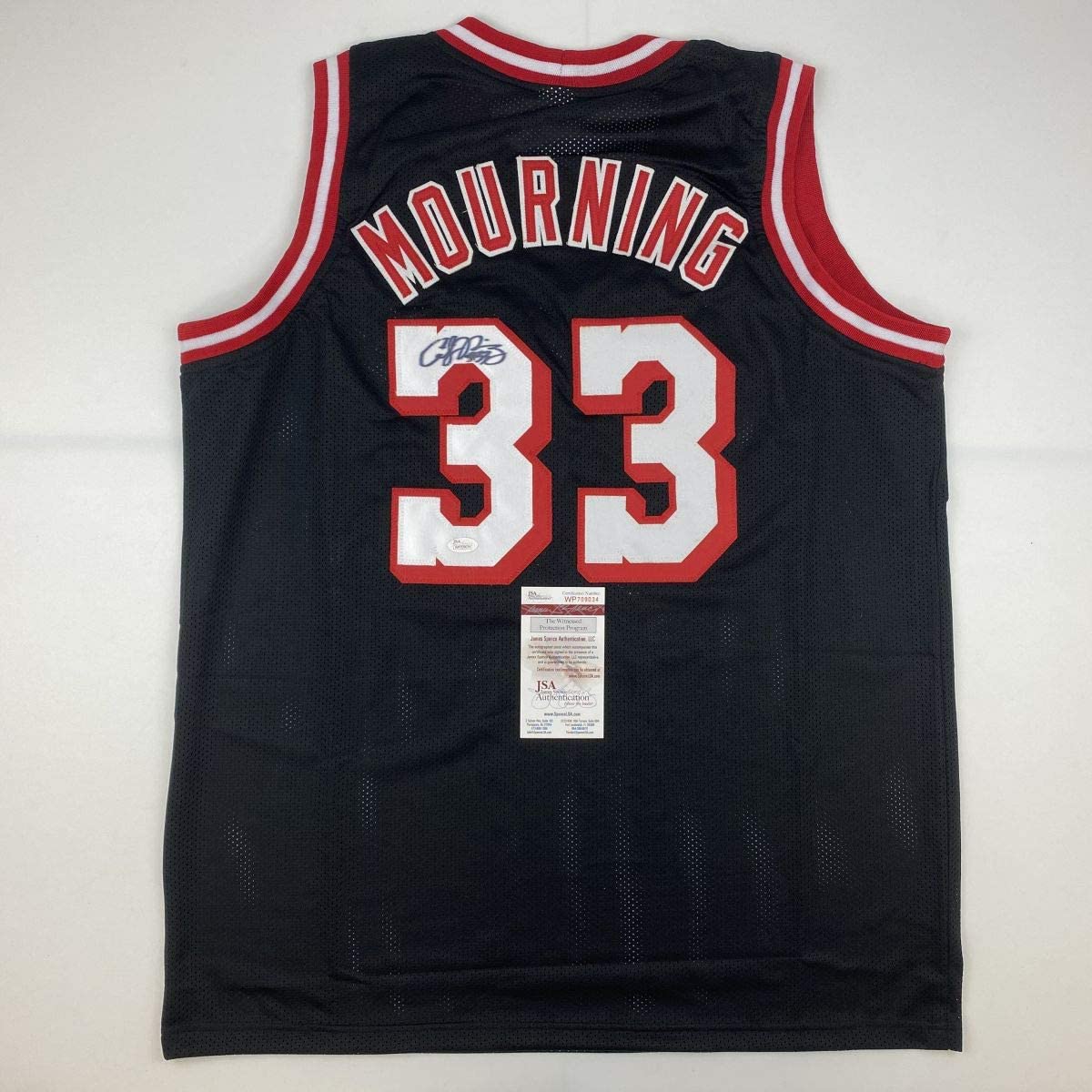 autographed-signed-alonzo-mourning-miami-black-basketball-jersey-jsa-coa