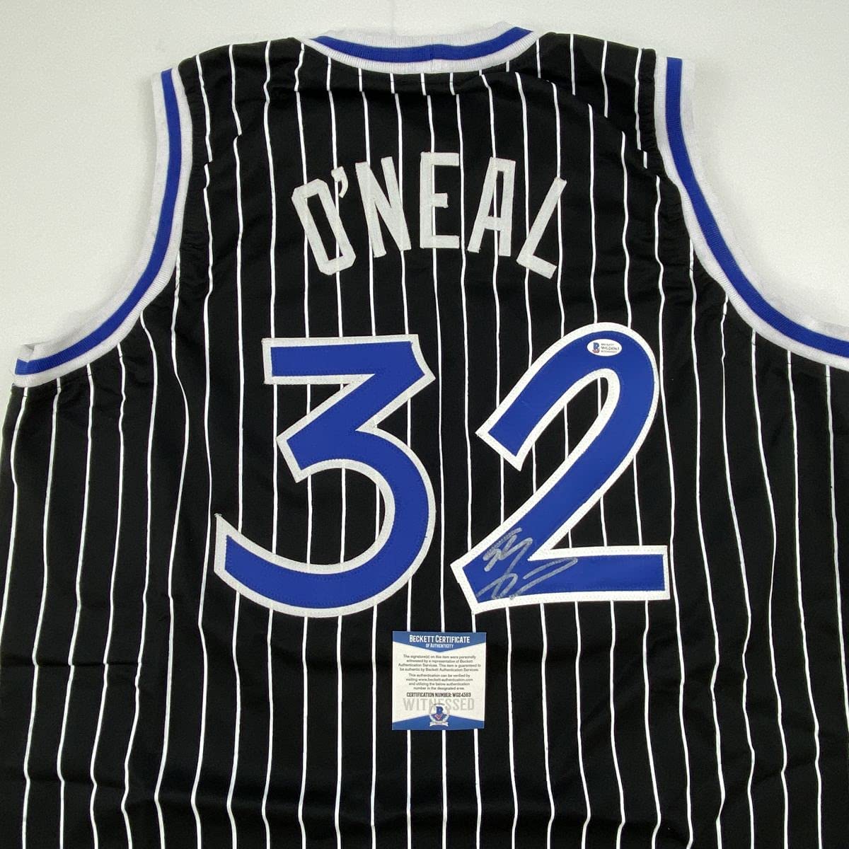 autographed-signed-shaquille-shaq-oneal-orlando-black-pinstripe-basketball-jersey-beckett-bas-coa