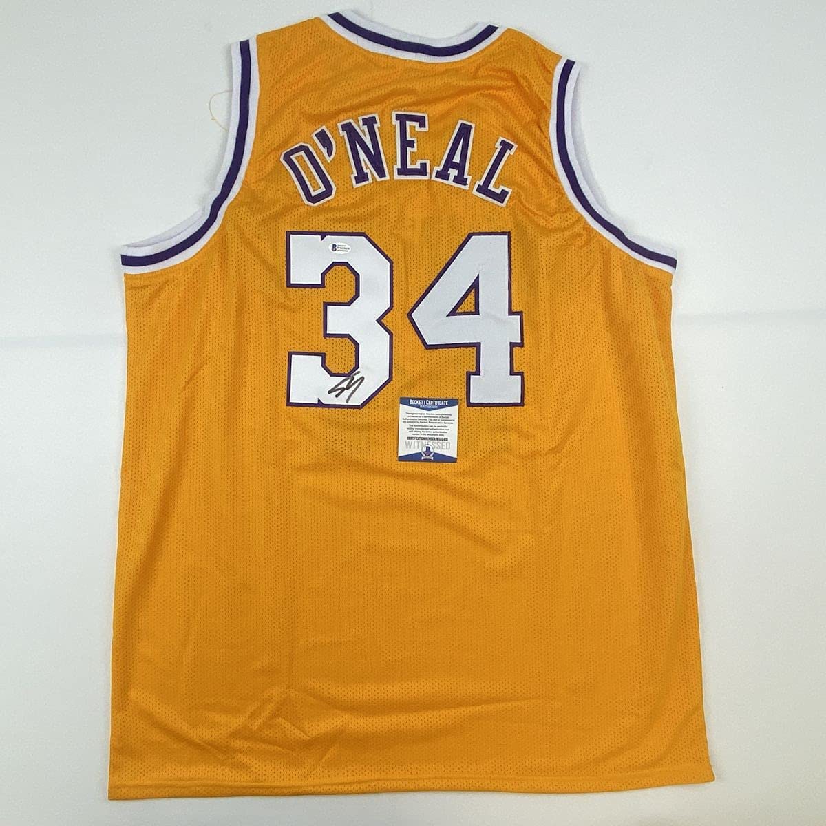 autographed-signed-shaquille-shaq-oneal-los-angeles-la-yellow-basketball-jersey-beckett-bas-coa