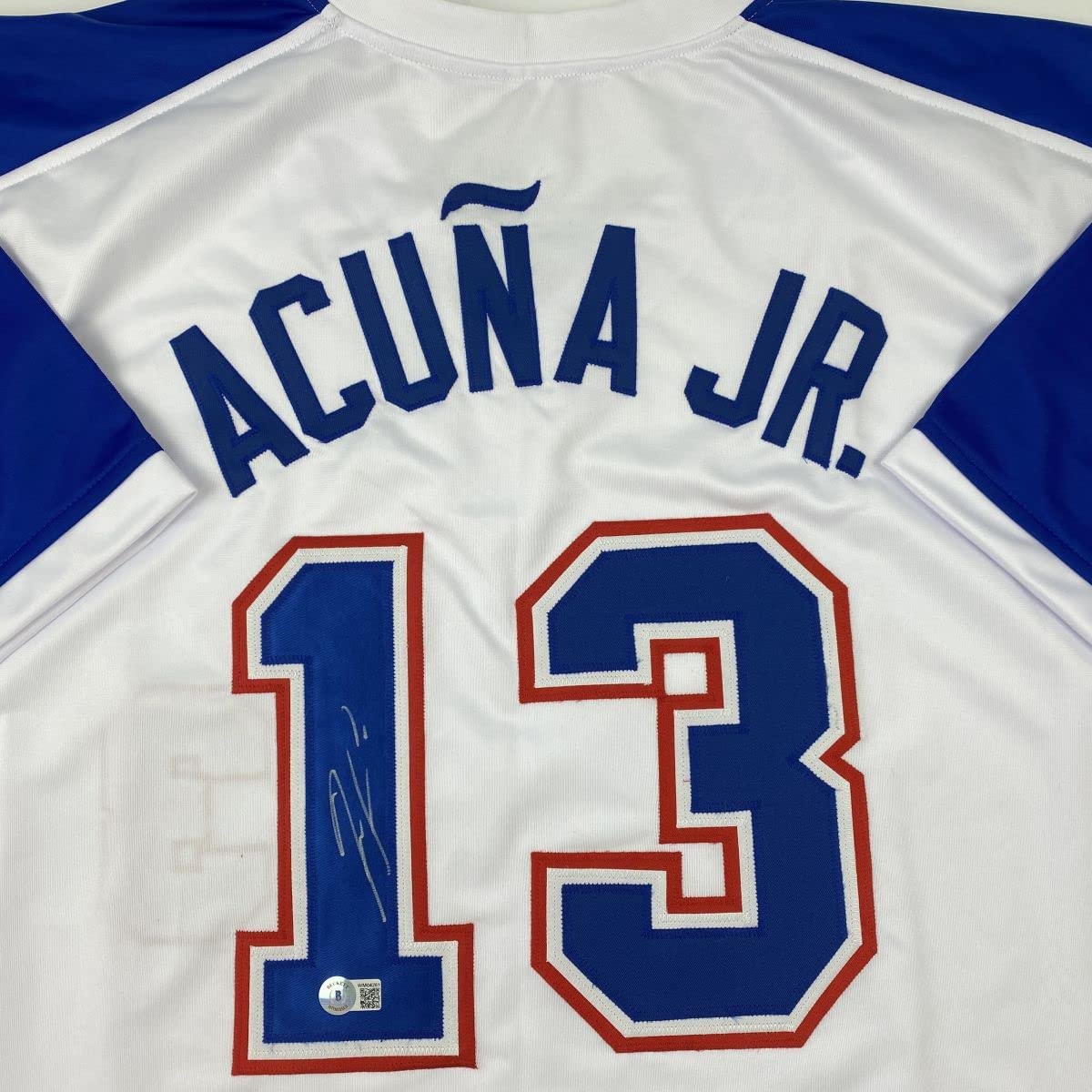 autographed-signed-ronald-acuna-jr-atlanta-white-retro-baseball-jersey-beckett-bas-coa