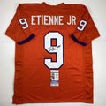autographed-signed-travis-etienne-jr-clemson-orange-college-football-jersey-jsa-coa