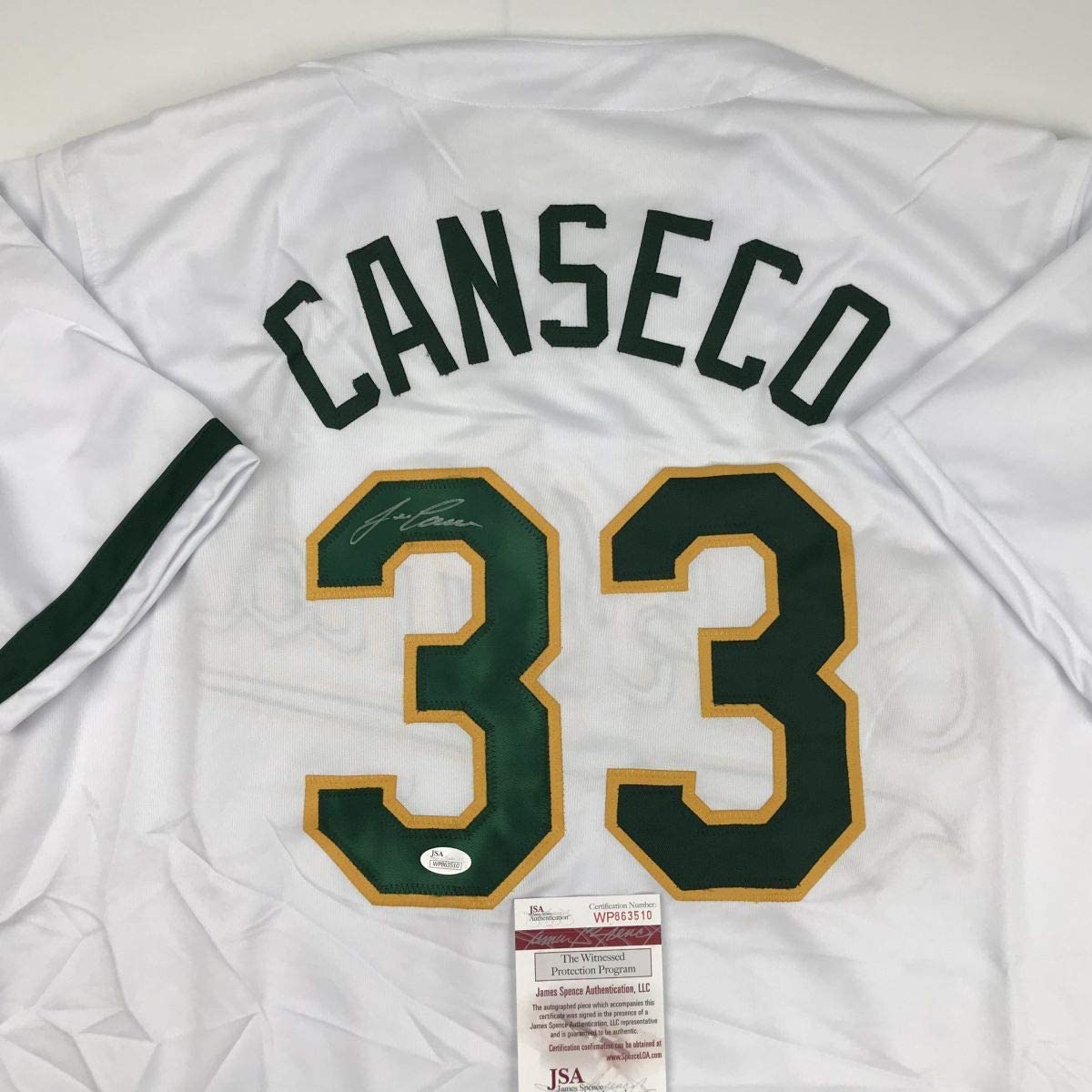 autographed-signed-jose-canseco-oakland-white-baseball-jersey-jsa-coa