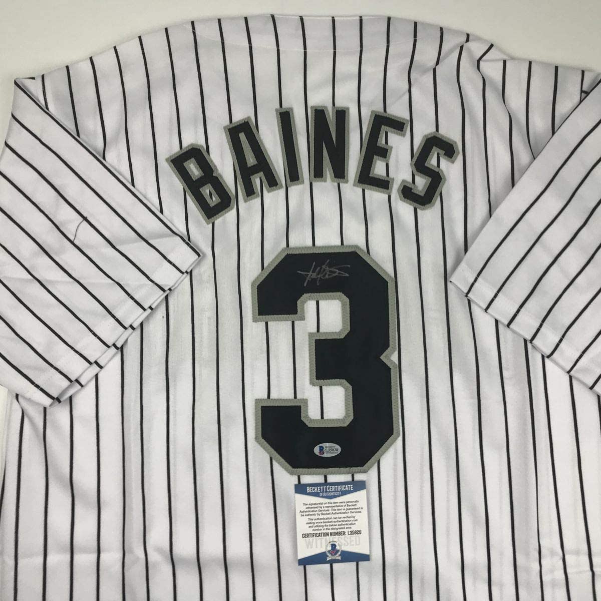 autographed-signed-harold-baines-chicago-pinstripe-baseball-jersey-beckett-bas-coa