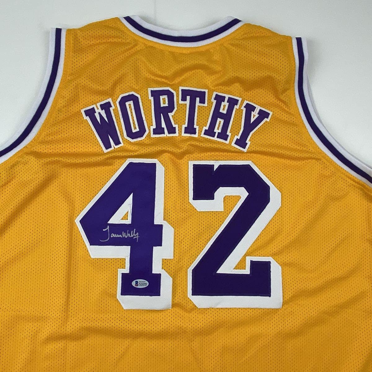 autographed-signed-james-worthy-los-angeles-la-yellow-basketball-jersey-beckett-bas-coa