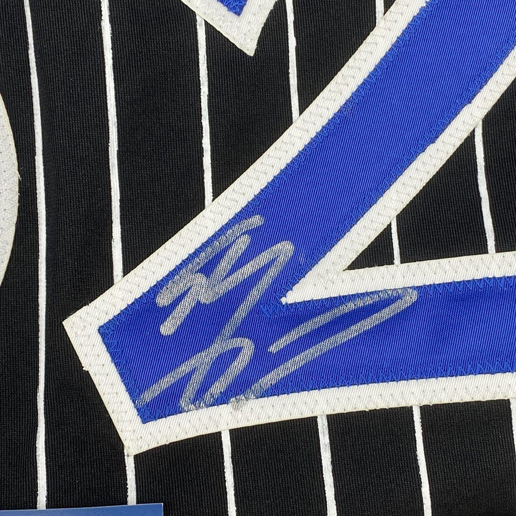 autographed-signed-shaquille-shaq-oneal-orlando-black-pinstripe-basketball-jersey-beckett-bas-coa