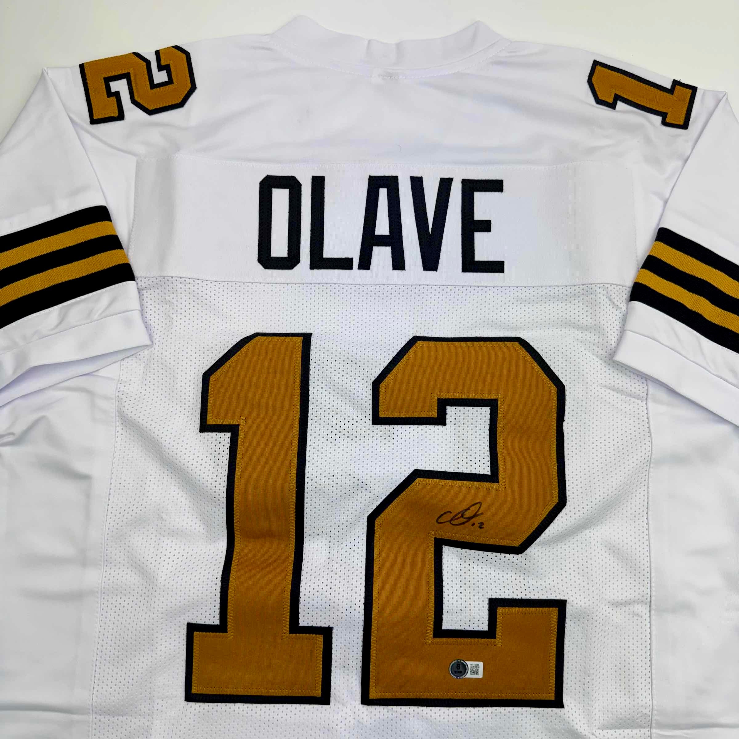 autographed-signed-chris-olave-new-orleans-white-color-rush-football-jersey-beckett-bas-coa