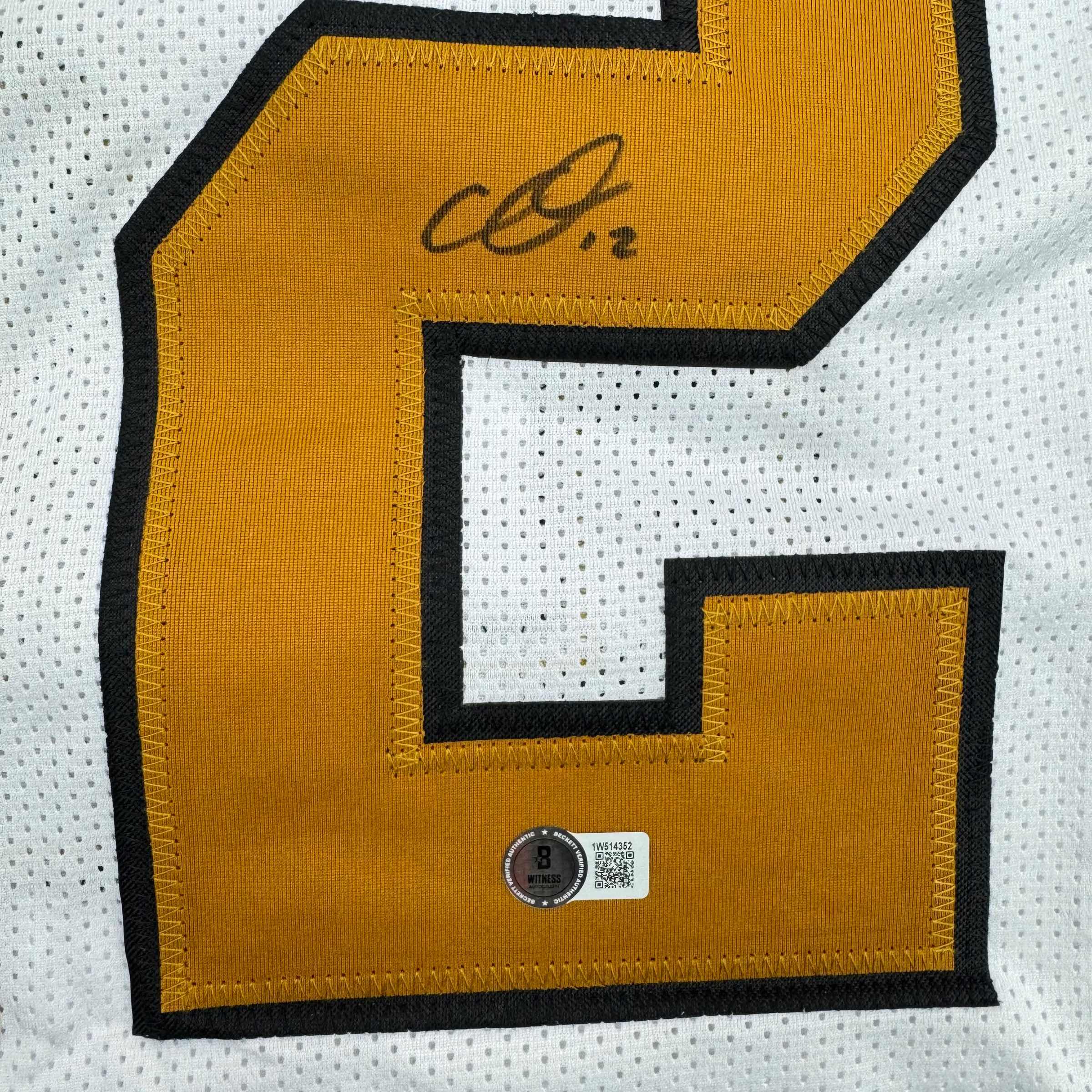 autographed-signed-chris-olave-new-orleans-white-color-rush-football-jersey-beckett-bas-coa