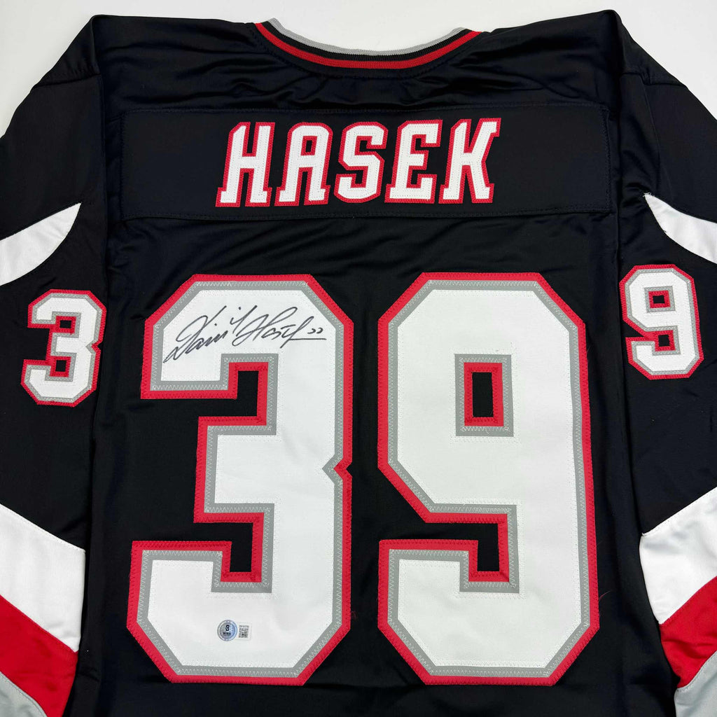 autographed-signed-dominik-hasek-buffalo-black-hockey-jersey-beckett-bas-coa