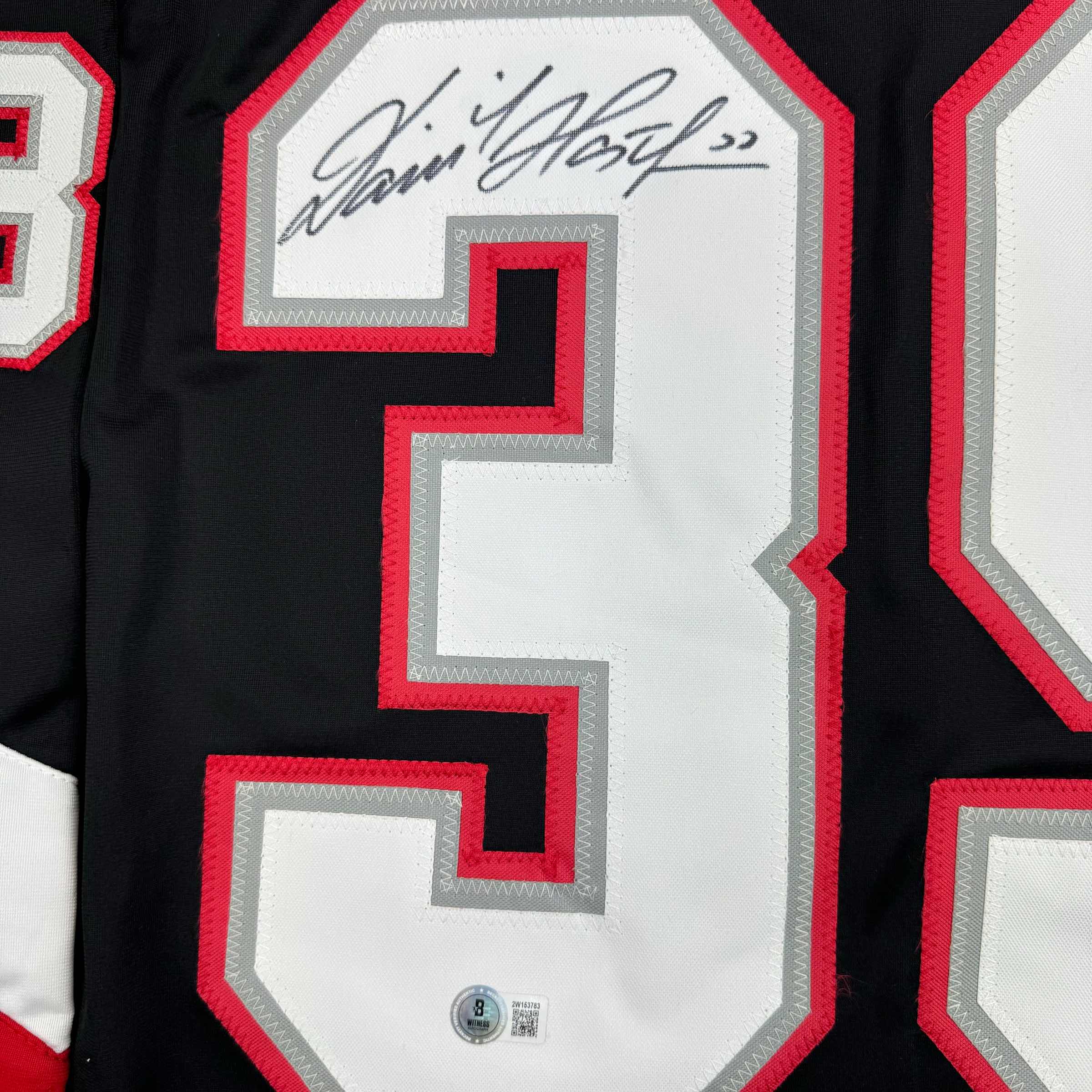 autographed-signed-dominik-hasek-buffalo-black-hockey-jersey-beckett-bas-coa