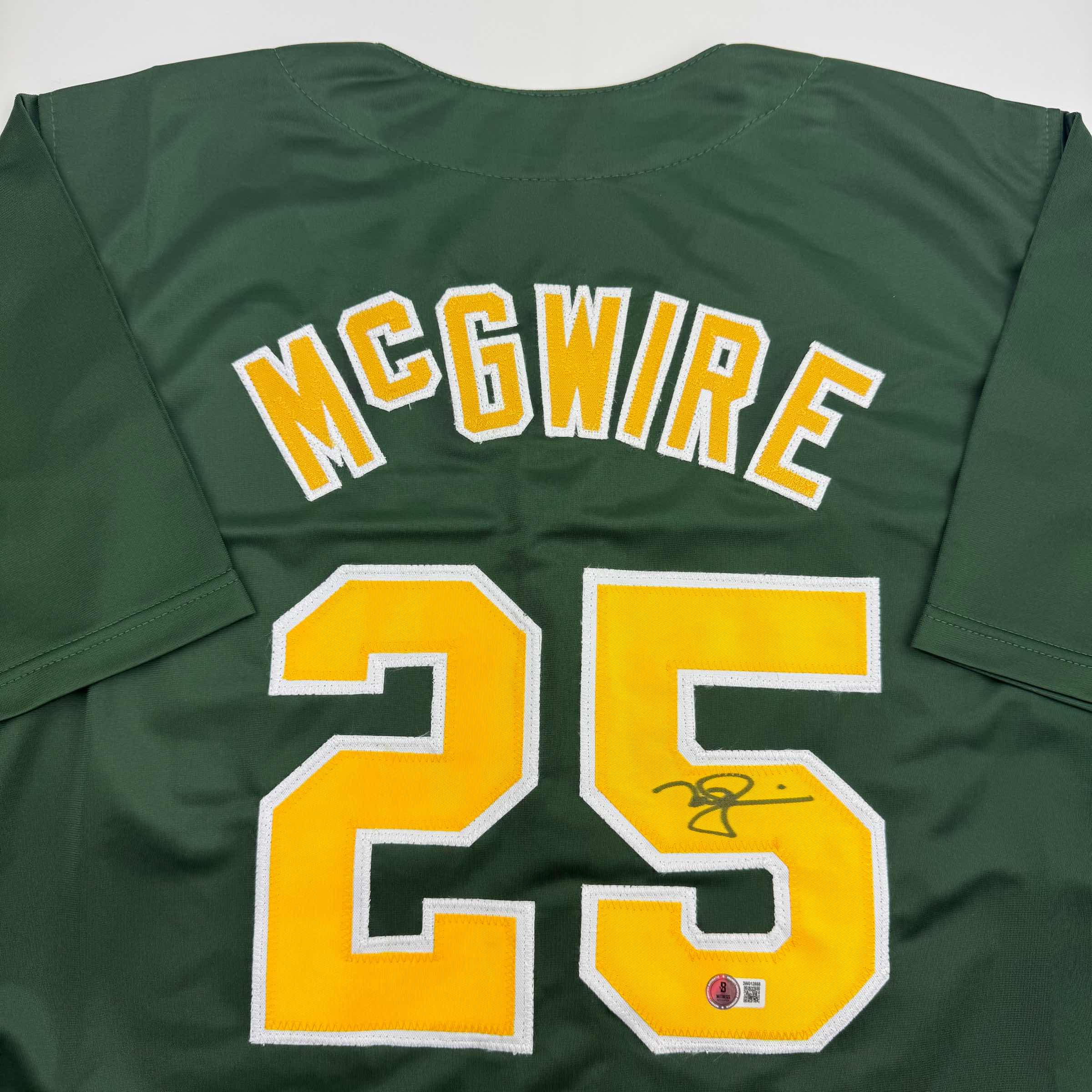 autographed-signed-mark-mcgwire-oakland-green-baseball-jersey-beckett-bas-coa