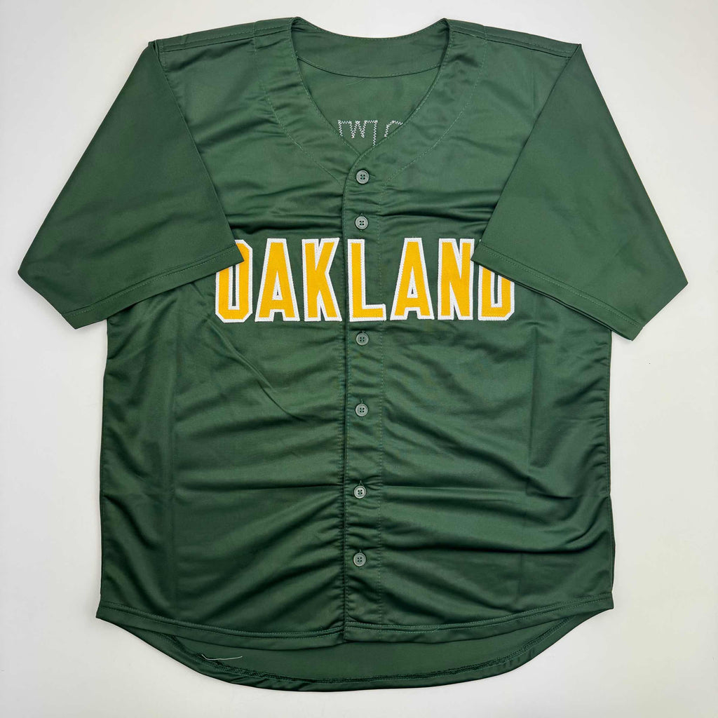 autographed-signed-mark-mcgwire-oakland-green-baseball-jersey-beckett-bas-coa