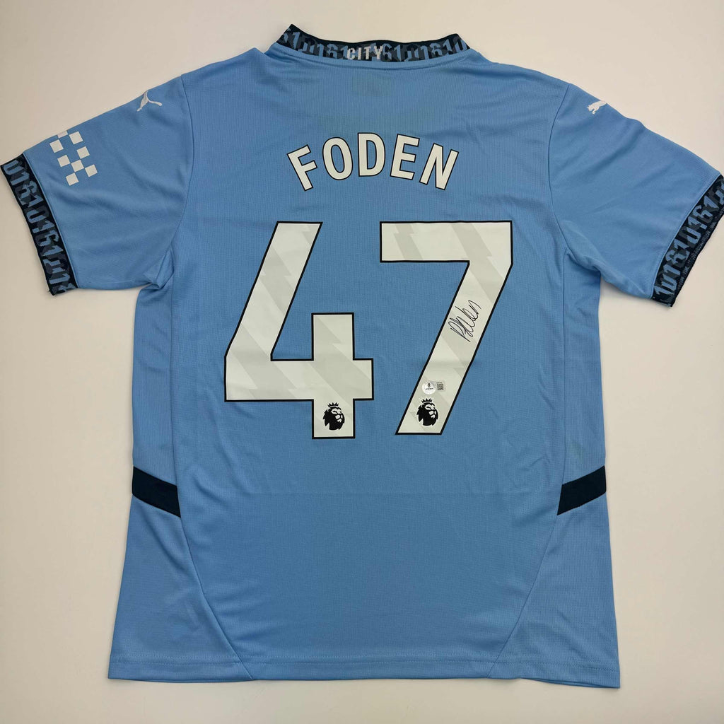 autographed-signed-phil-foden-manchester-city-blue-soccer-futbol-jersey-beckett-bas-coa-3