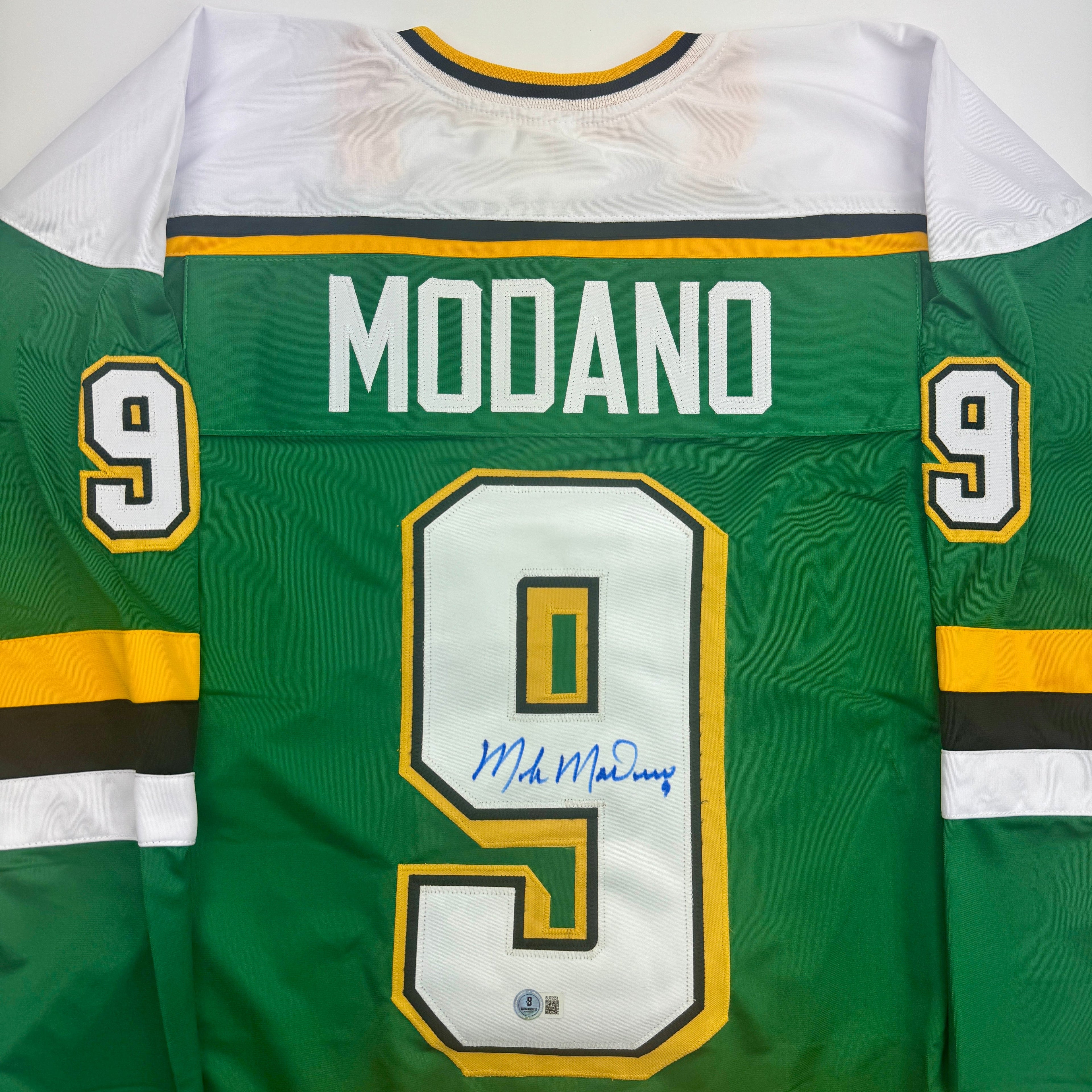 autographed-signed-mike-modano-minnesota-green-hockey-jersey-beckett-bas-coa