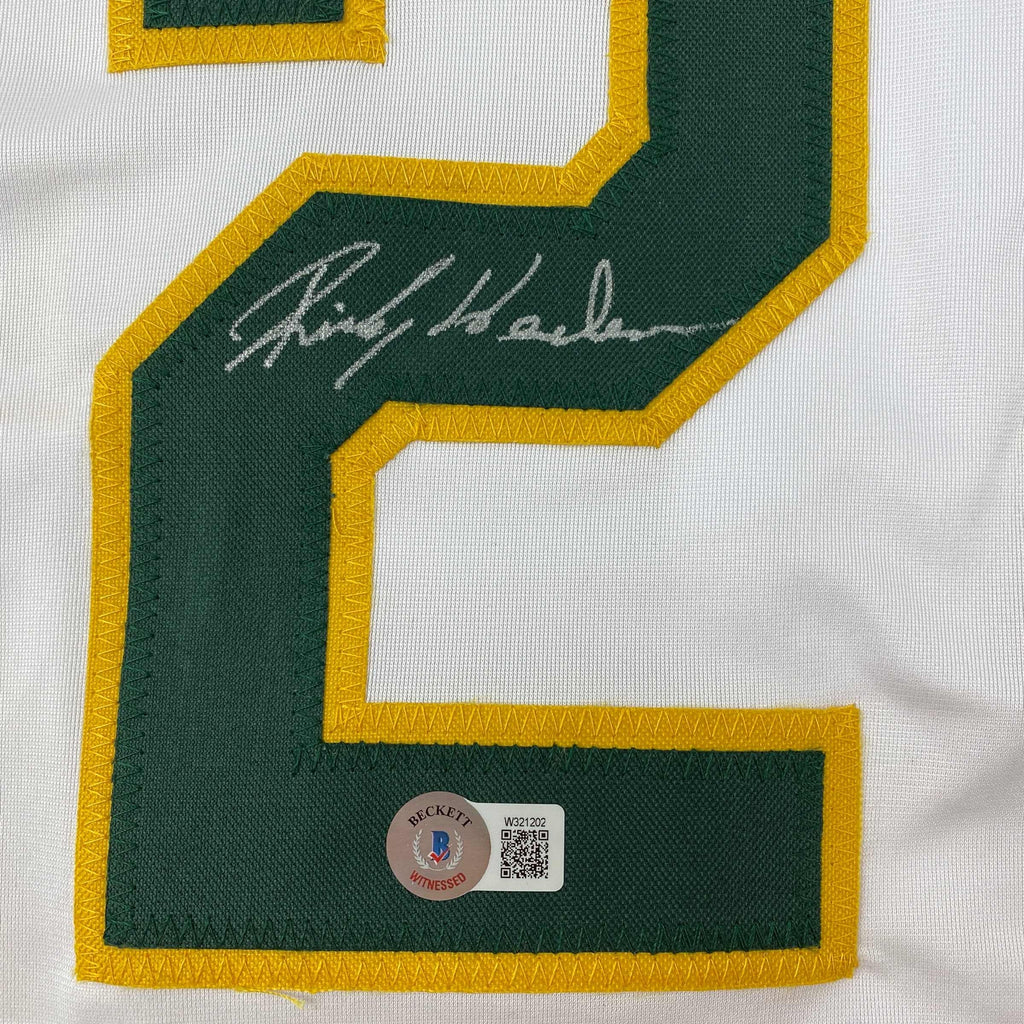 autographed-signed-rickey-henderson-oakland-white-baseball-jersey-beckett-bas-coa