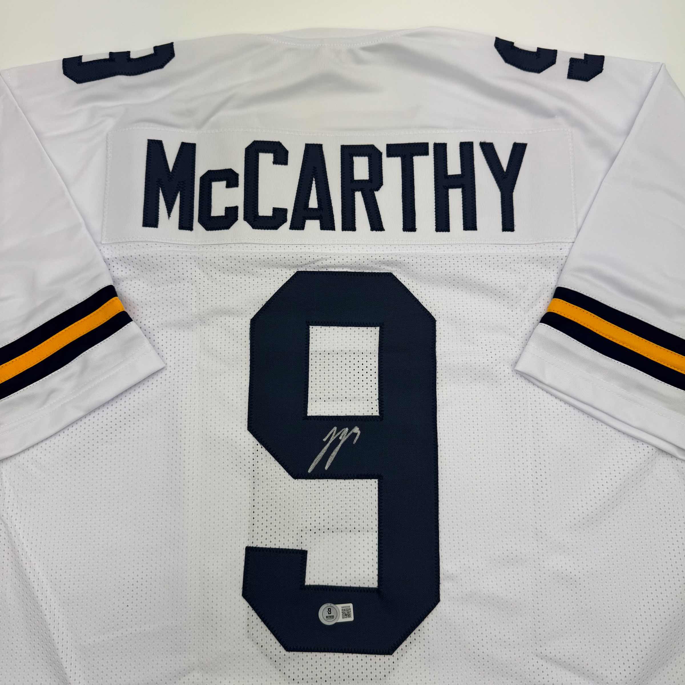autographed-signed-j-j-jj-mccarthy-michigan-white-college-football-jersey-beckett-bas-coa