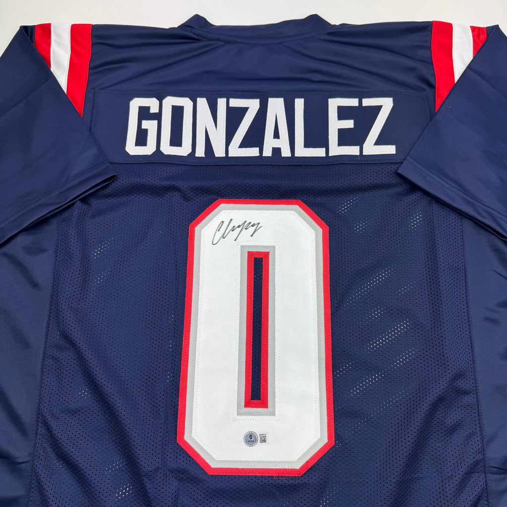 autographed-signed-christian-gonzalez-new-england-blue-football-jersey-beckett-bas-coa