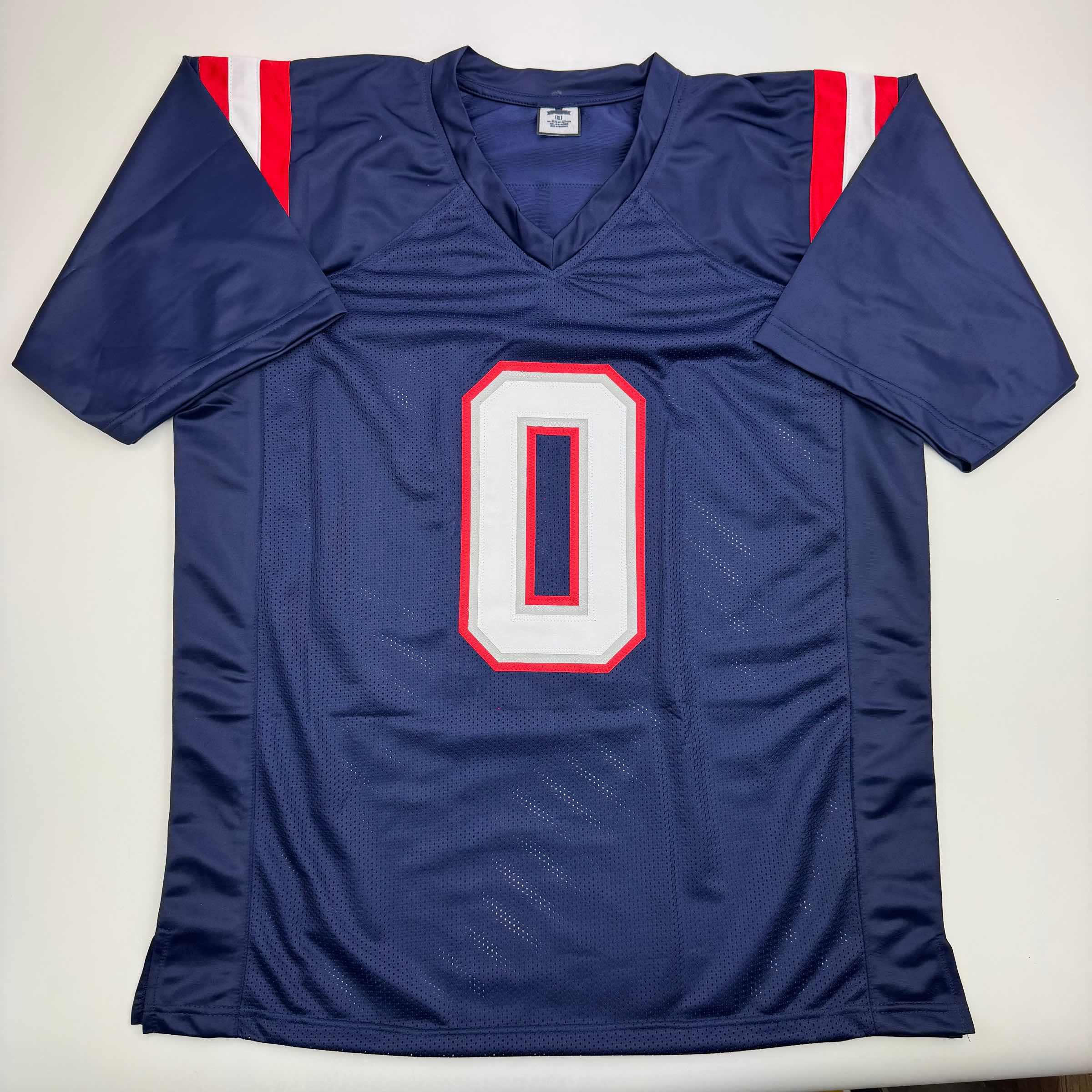 autographed-signed-christian-gonzalez-new-england-blue-football-jersey-beckett-bas-coa