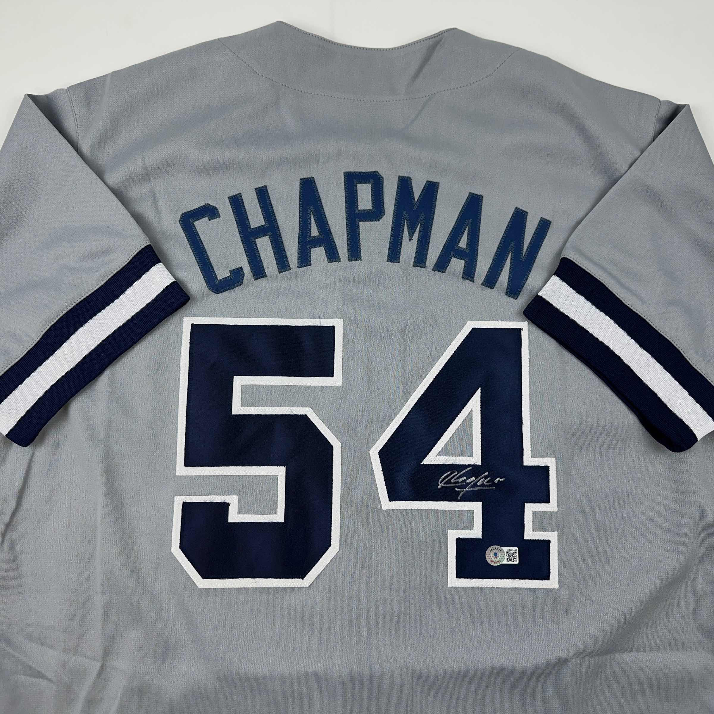 autographed-signed-aroldis-chapman-new-york-grey-baseball-jersey-beckett-bas-coa