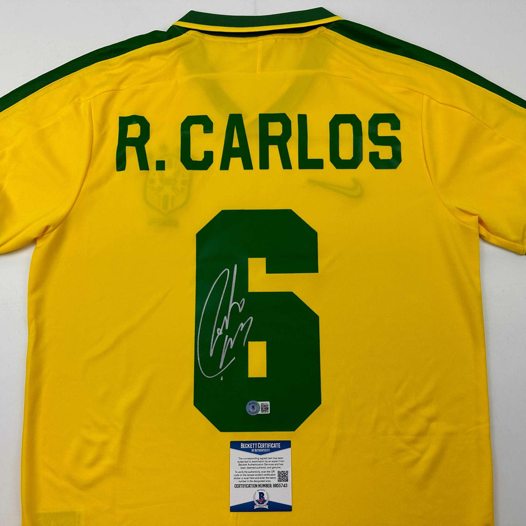autographed-signed-roberto-carlos-brazil-yellow-retro-soccer-jersey-beckett-bas-coa