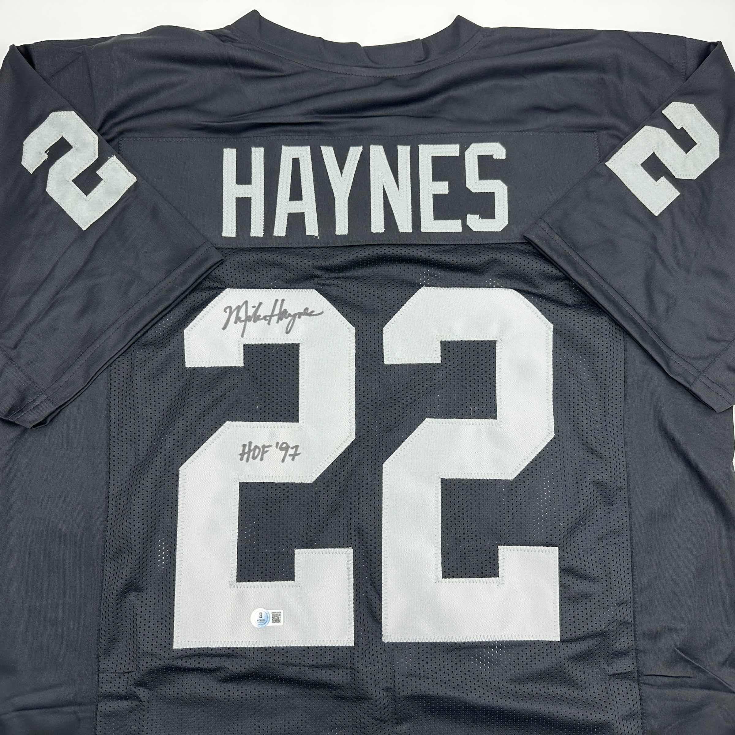 autographed-signed-michael-mike-haynes-hof-97-oakland-black-football-jersey-beckett-bas-coa