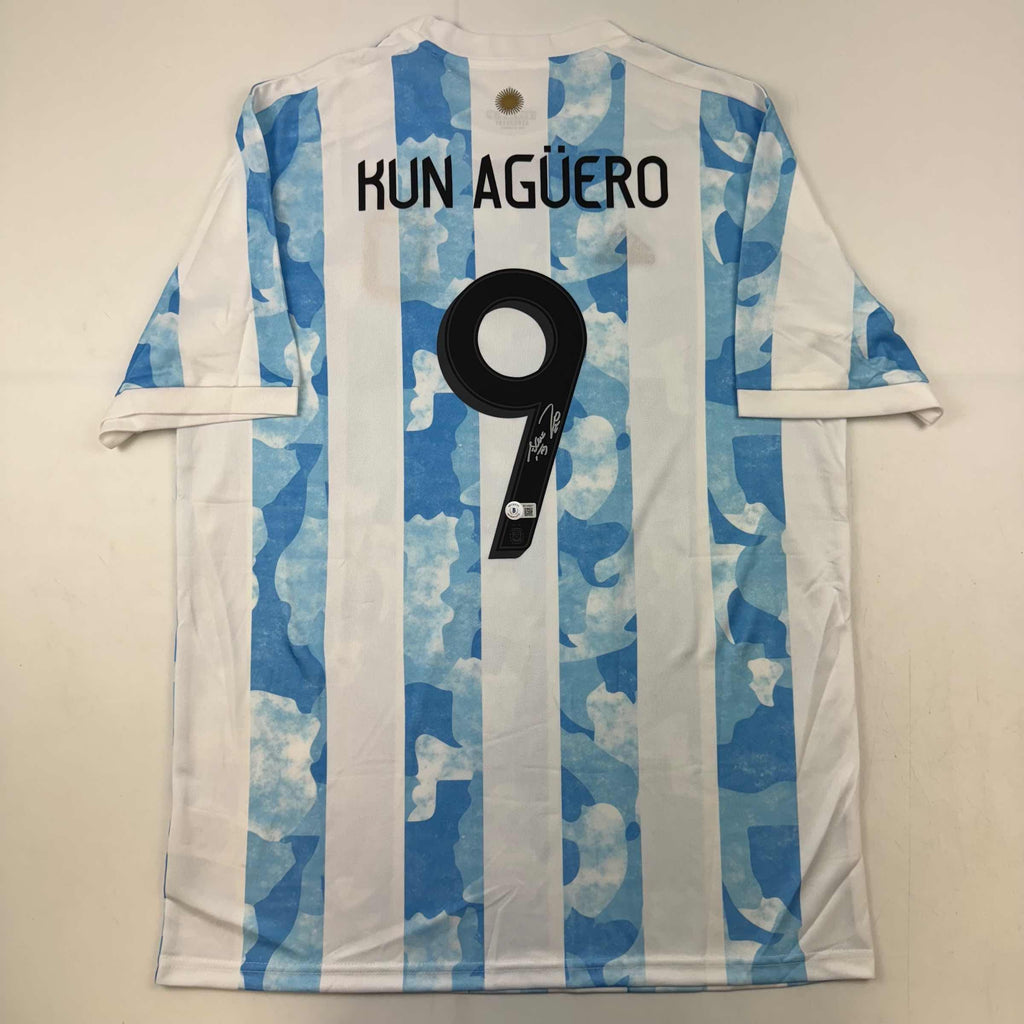 autographed-signed-sergio-kun-aguero-2021-argentina-home-blue-soccer-futbol-jersey-beckett-bas-coa