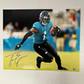 autographed-signed-travis-etienne-jr-jacksonville-jaguars-16x20-football-photo-beckett-bas-coa