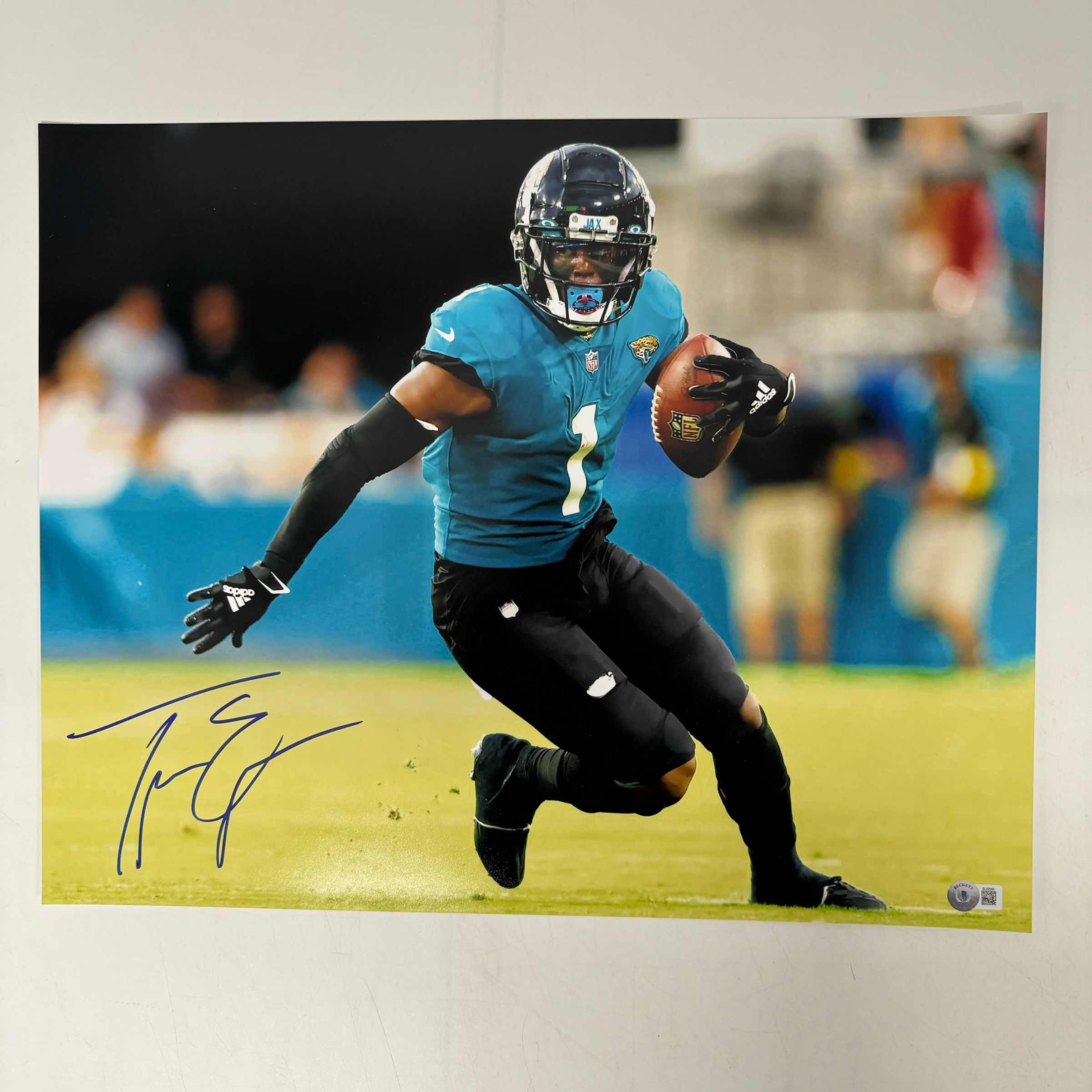 autographed-signed-travis-etienne-jr-jacksonville-jaguars-16x20-football-photo-beckett-bas-coa