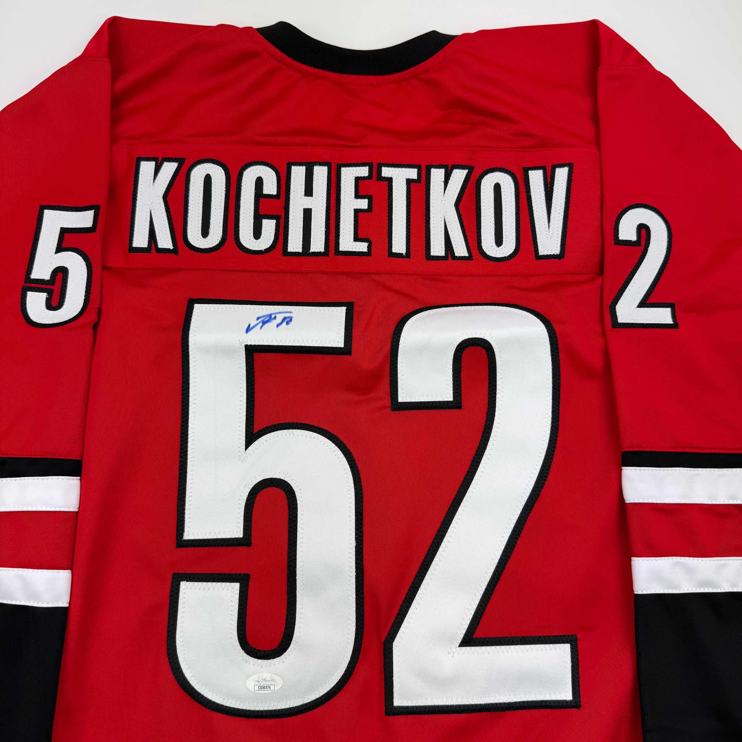 autographed-signed-pyotr-kochetkov-carolina-red-hockey-jersey-jsa-coa