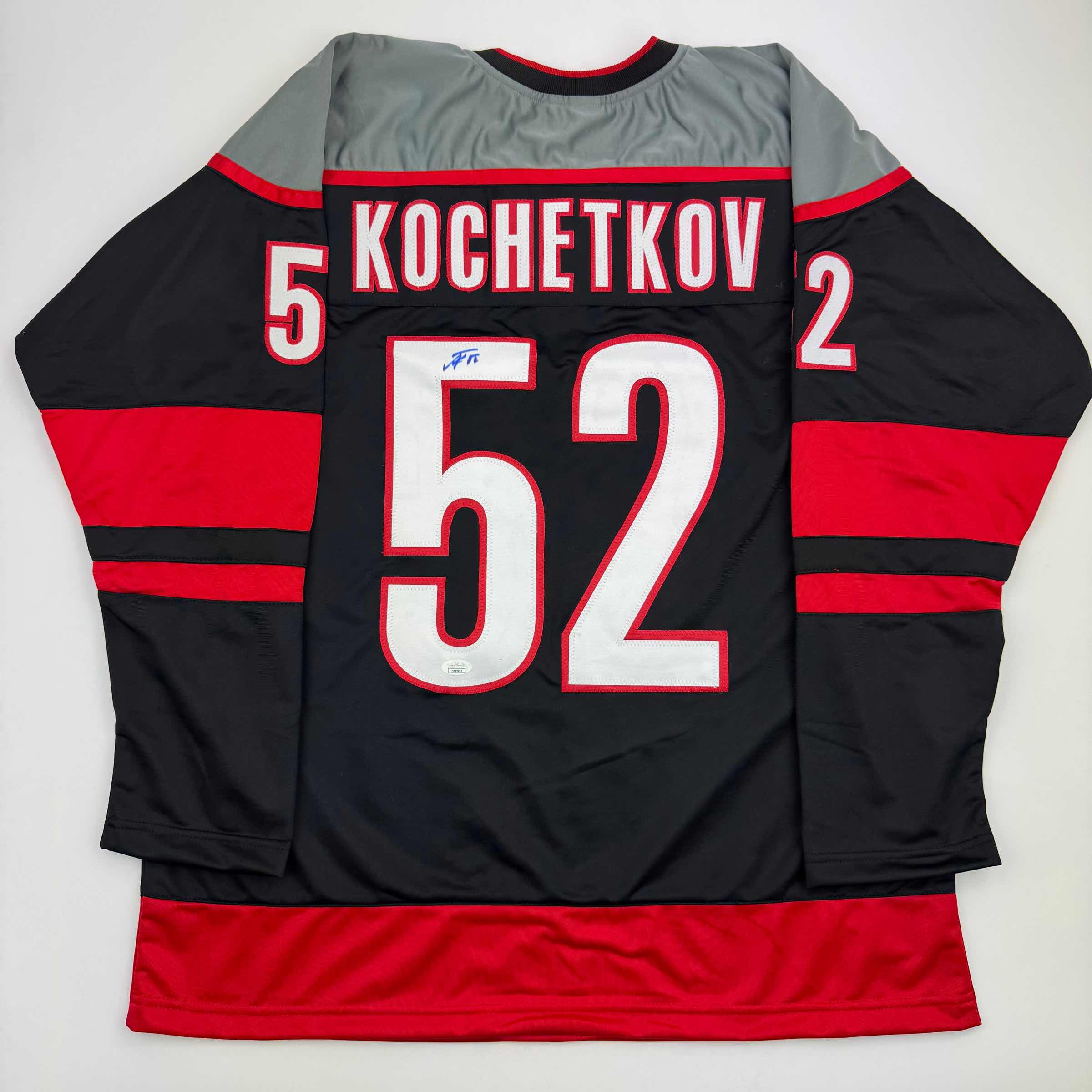 autographed-signed-pyotr-kochetkov-carolina-black-hockey-jersey-jsa-coa