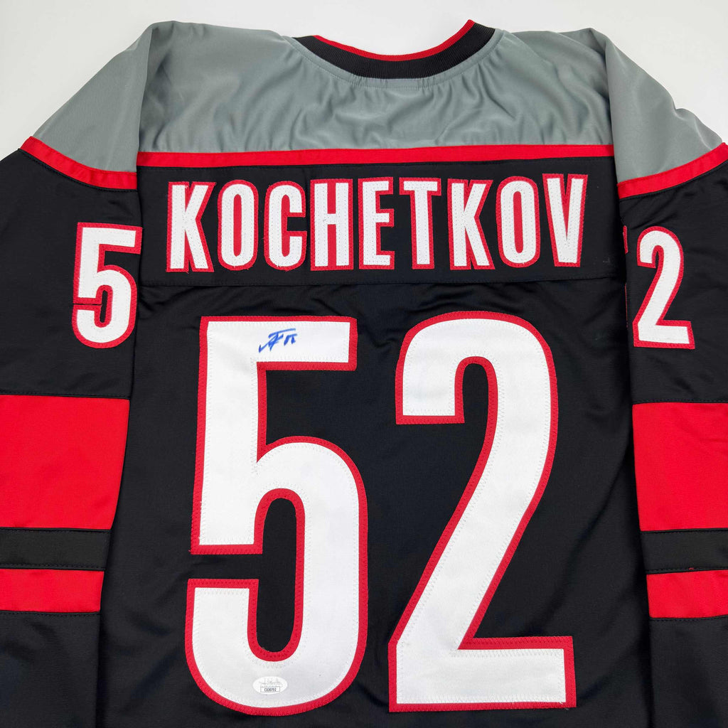 autographed-signed-pyotr-kochetkov-carolina-black-hockey-jersey-jsa-coa