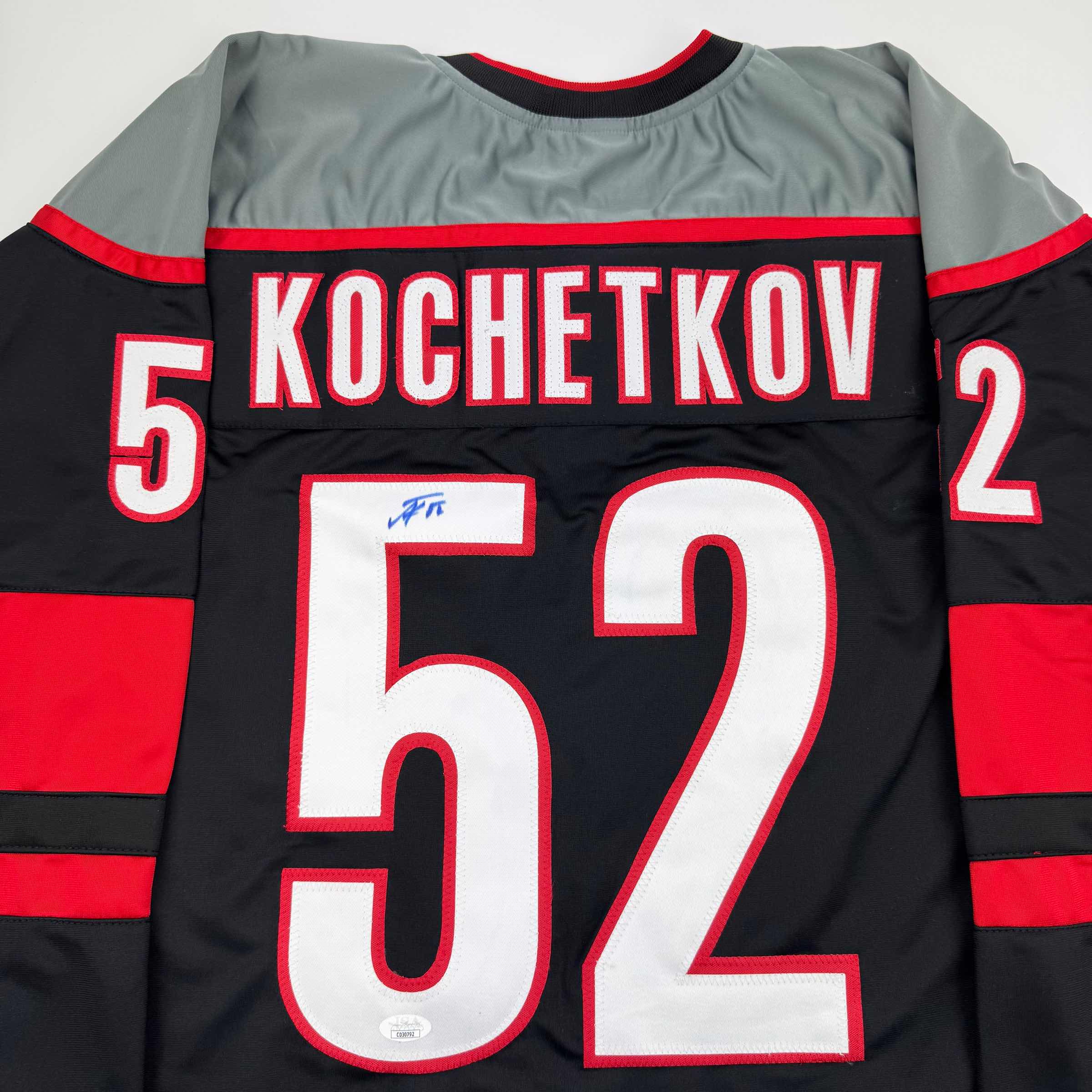 autographed-signed-pyotr-kochetkov-carolina-black-hockey-jersey-jsa-coa