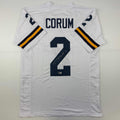 autographed-signed-blake-corum-michigan-white-college-football-jersey-beckett-bas-coa