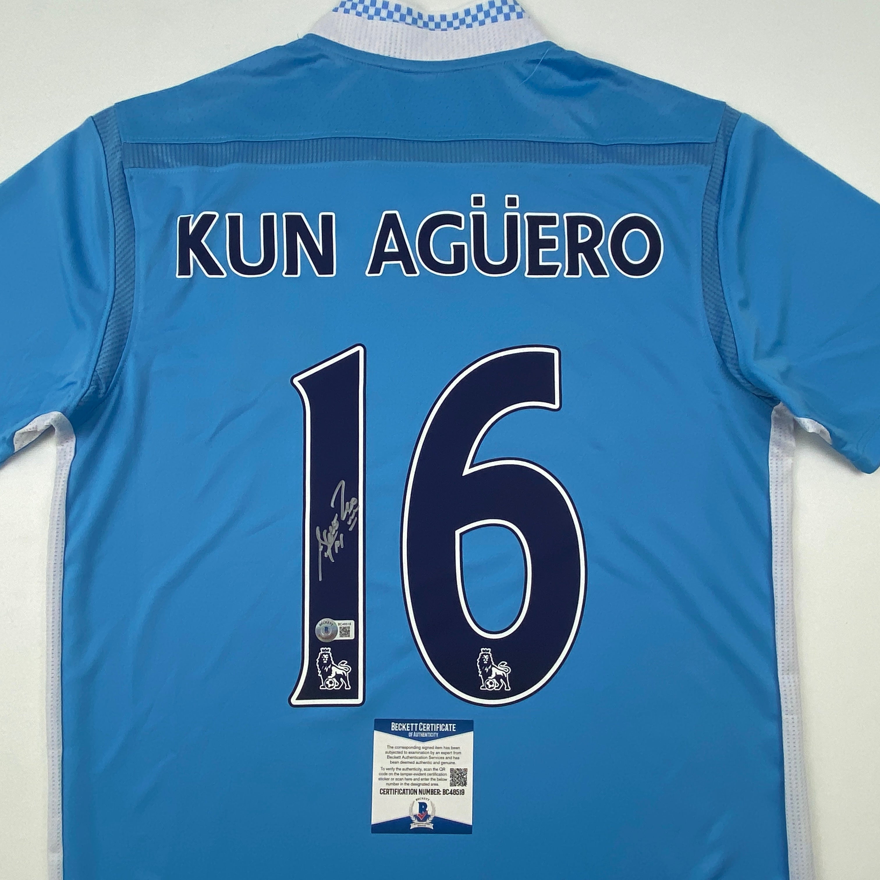 autographed-signed-sergio-kun-aguero-manchester-city-blue-soccer-futbol-jersey-beckett-bas-coa