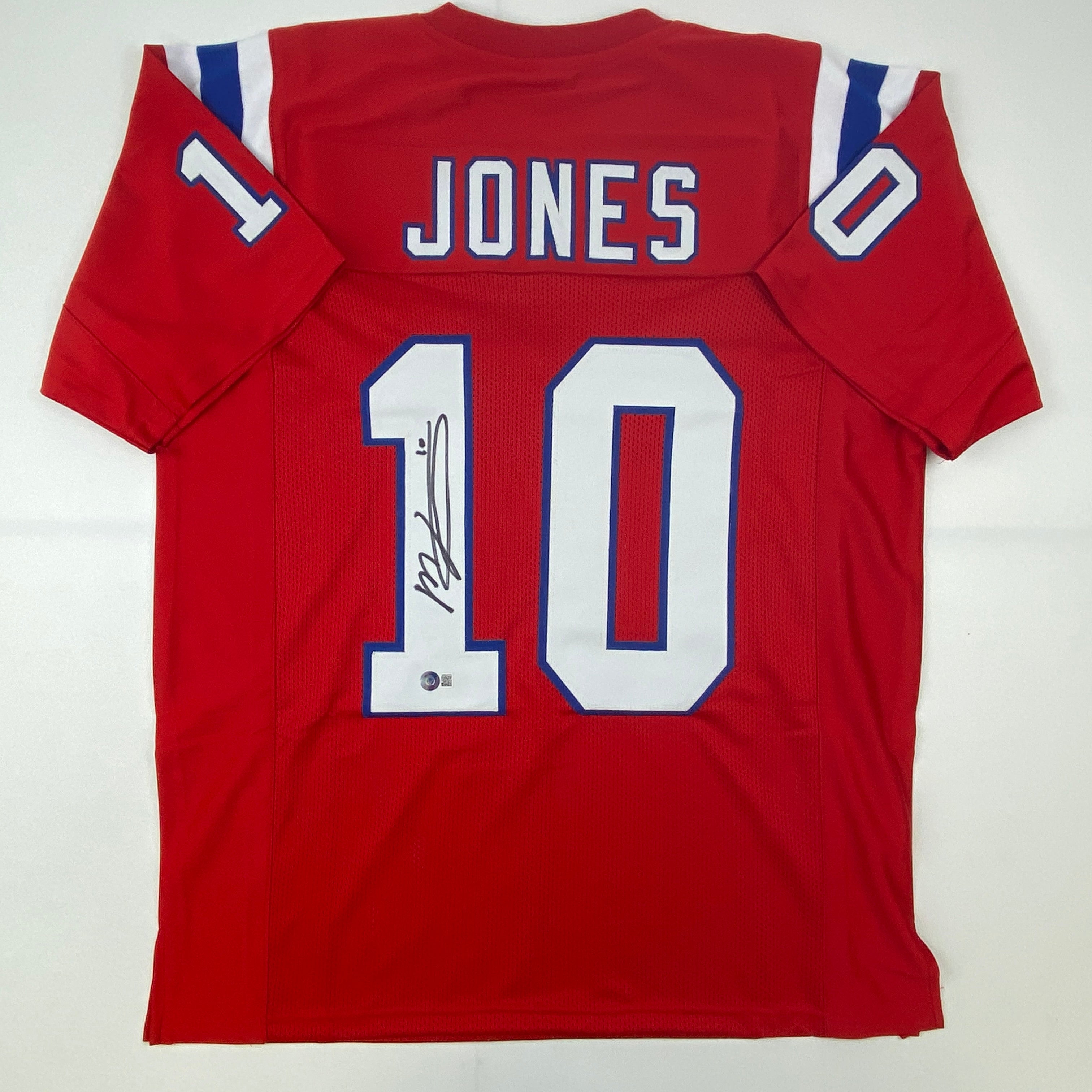 autographed-signed-mac-jones-new-england-red-football-jersey-beckett-bas-coa