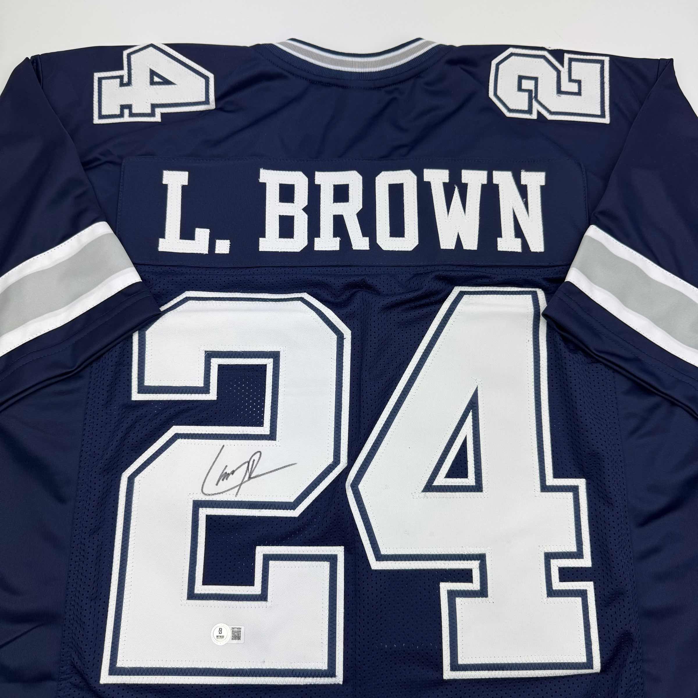 autographed-signed-larry-brown-dallas-blue-football-jersey-beckett-bas-coa