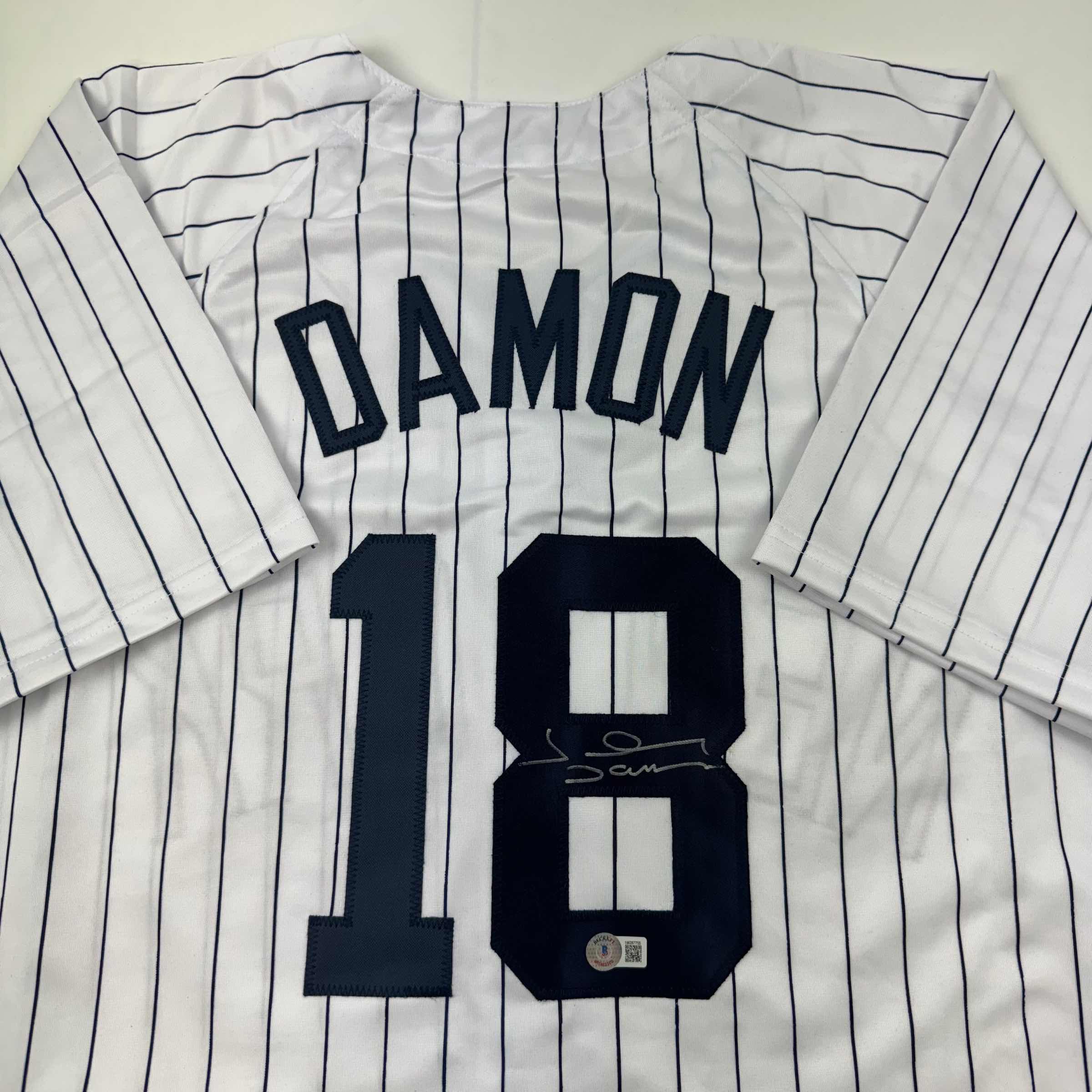 autographed-signed-johnny-damon-new-york-pinstripe-baseball-jersey-beckett-bas-coa