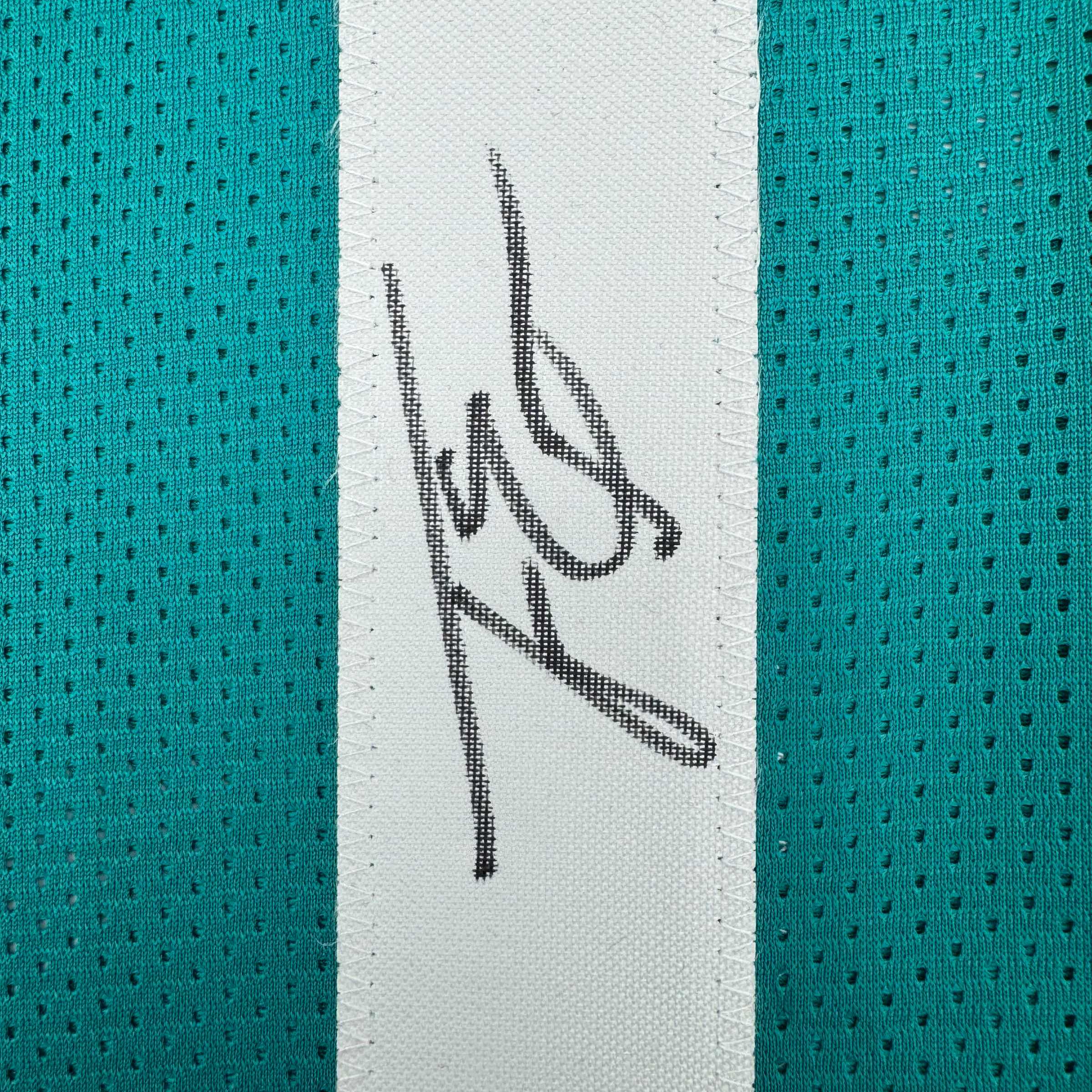 autographed-signed-travis-etienne-jr-jacksonville-teal-football-jersey-beckett-bas-coa